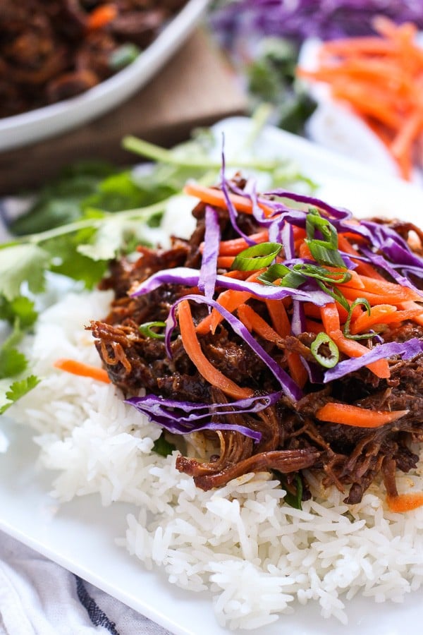 Slow Cooker Asian Shredded Pork on top of a bed of rice