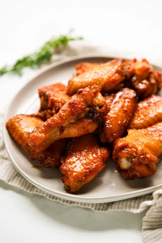 A plate piled with hot honey wings