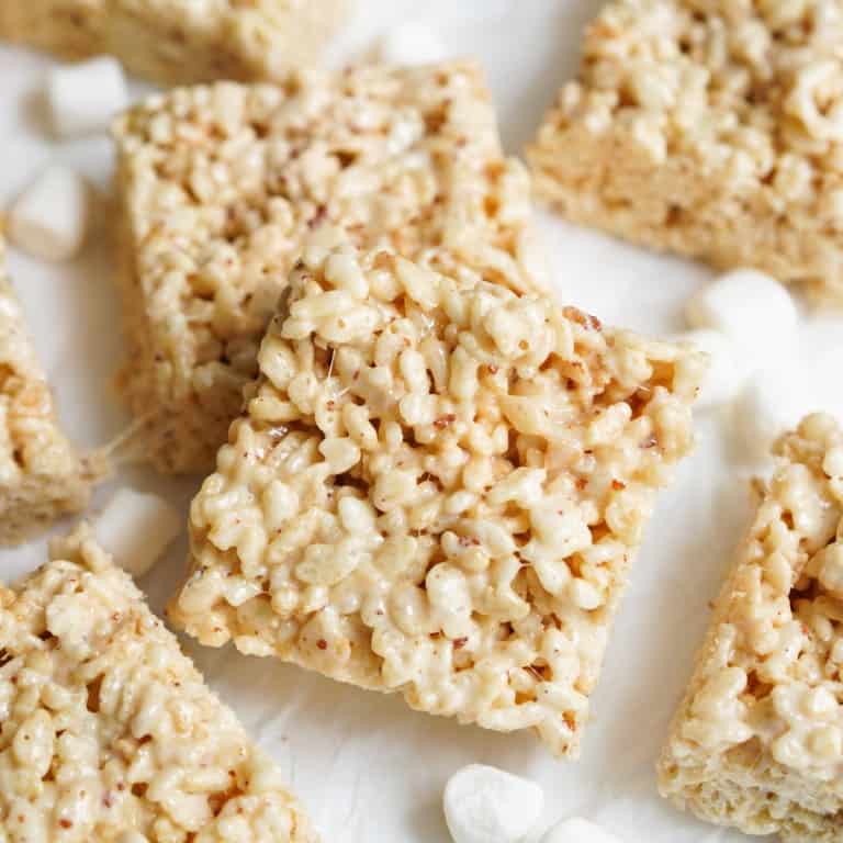 A square piece of rice krispie treats with brown specs