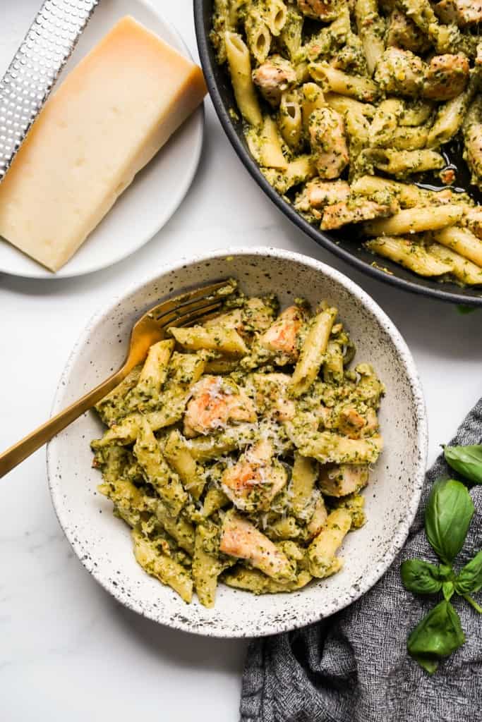 Top down view of a serving of creamy pesto chicken pasta