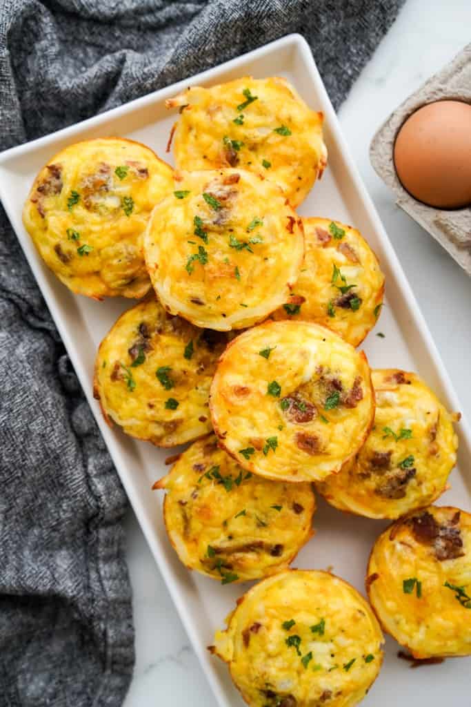 A rectangular platter of hashbrown egg cups