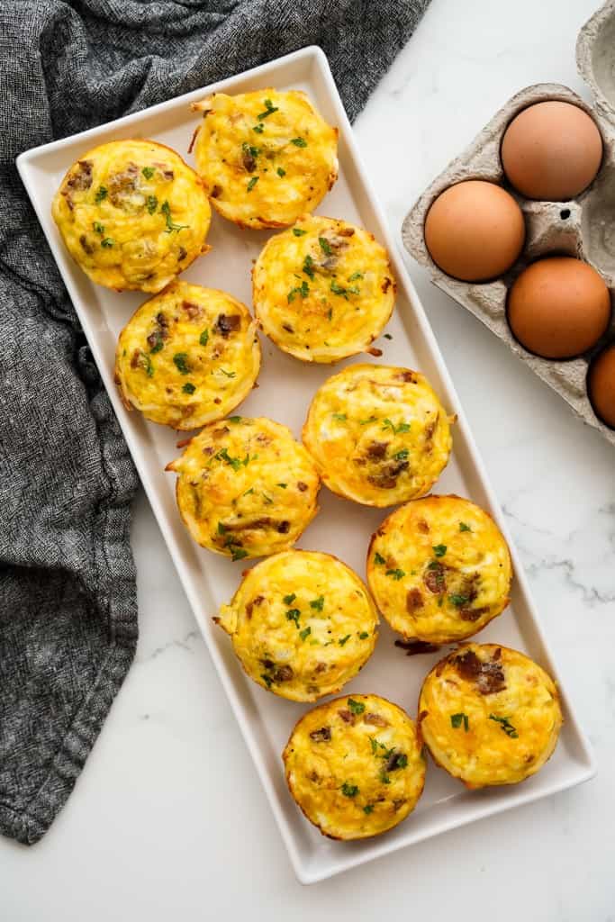 A large rectangular platter of hash brown egg cups