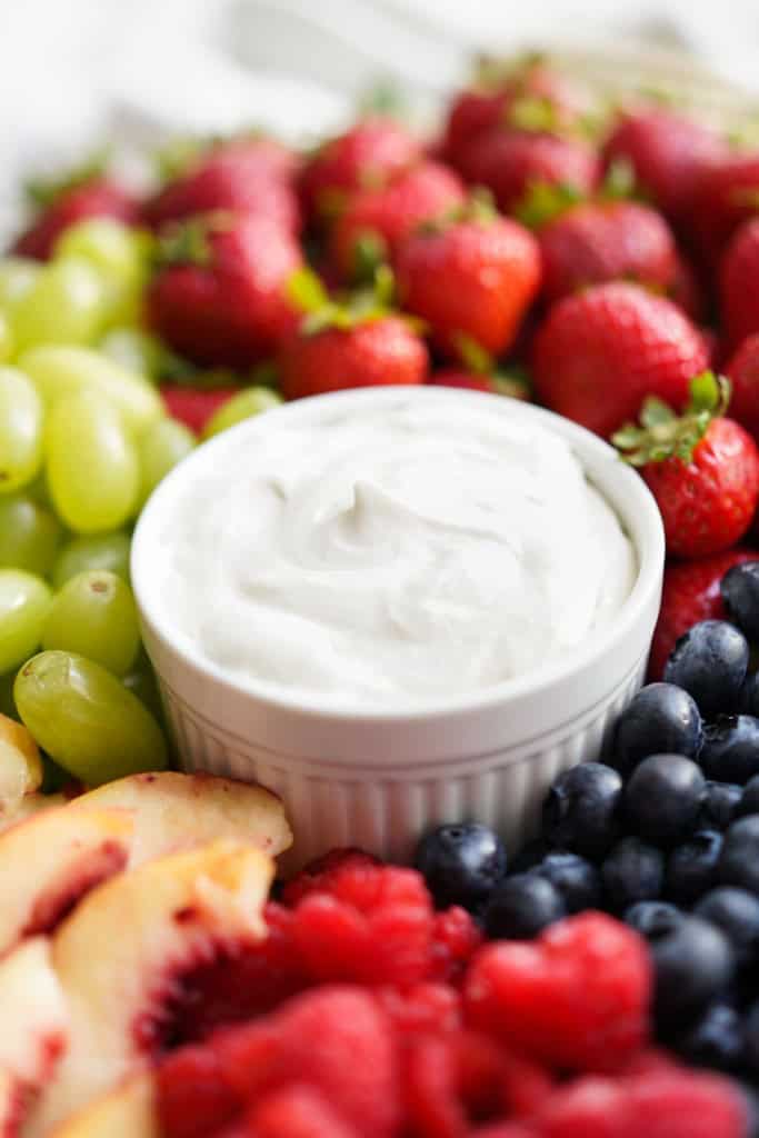 Closeup of a bowl of fluffy fruit dip made with  marshmallow fluff 